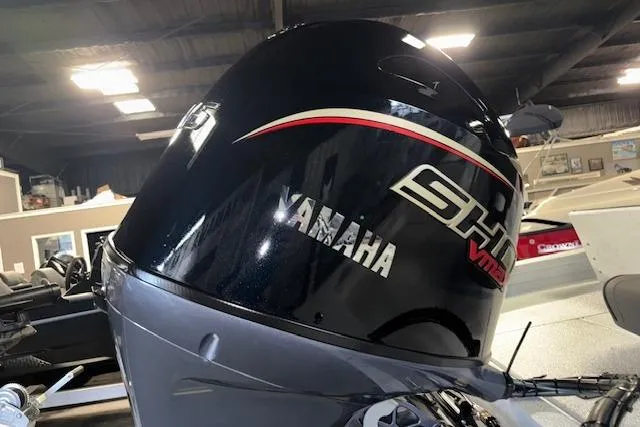 Slide: The Image of 2026 Xpress H20B Bay boat with Yamaha SHO VMAX outboard engine in showroom. - 8