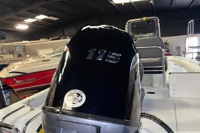 Slide: The Image of 2026 Xpress H20B Bay boat with 115 horsepower engine in showroom. - 9