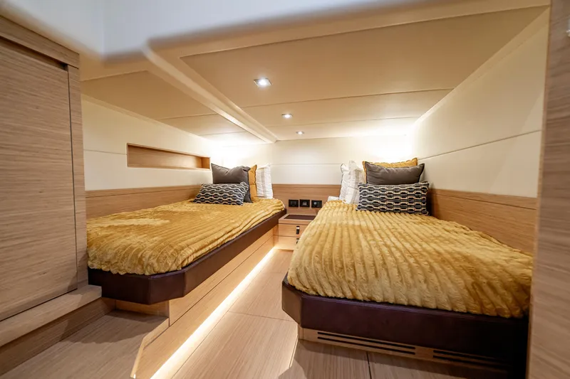 Slide: The Image of Luxurious twin cabin interior of 2023 Pardo Yachts 50, featuring elegant bedding and modern design. - 24