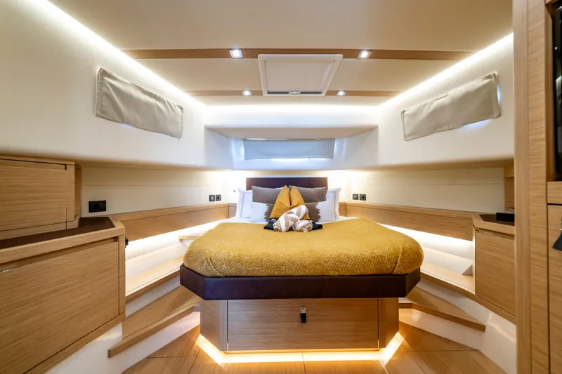 Slide: The Image of Luxurious cabin interior of 2023 Pardo Yachts 50, featuring elegant wood finishes and ambient lighting. - 25