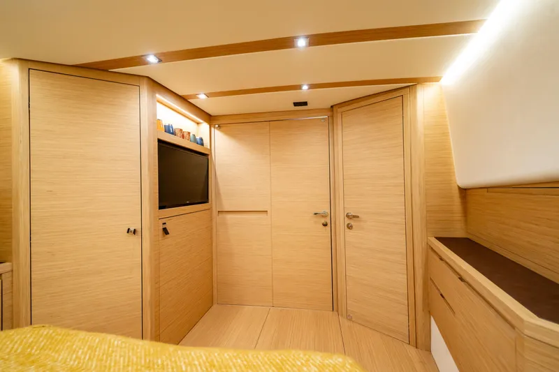 Slide: The Image of Luxurious interior of 2023 Pardo Yachts 50, featuring elegant wood paneling and modern lighting. - 26