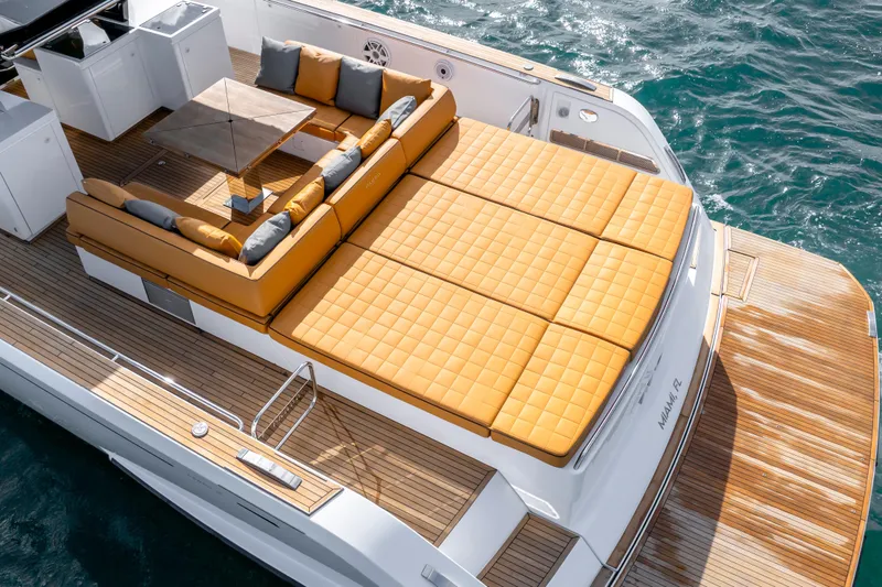 Slide: The Image of Luxurious 2023 Pardo Yachts 50 with spacious sun deck and elegant seating on the water. - 4
