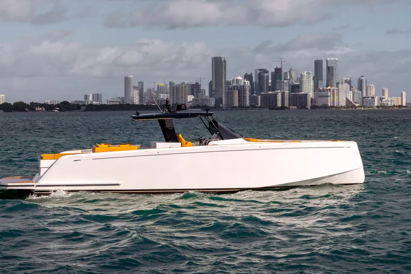 Slide: The Image of 2023 Pardo Yachts 50 cruising near a city skyline on a sunny day. - 1