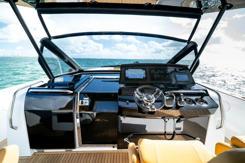 Slide: The Image of Luxurious helm of 2023 Pardo Yachts 50, featuring modern navigation equipment and ocean view. - 10