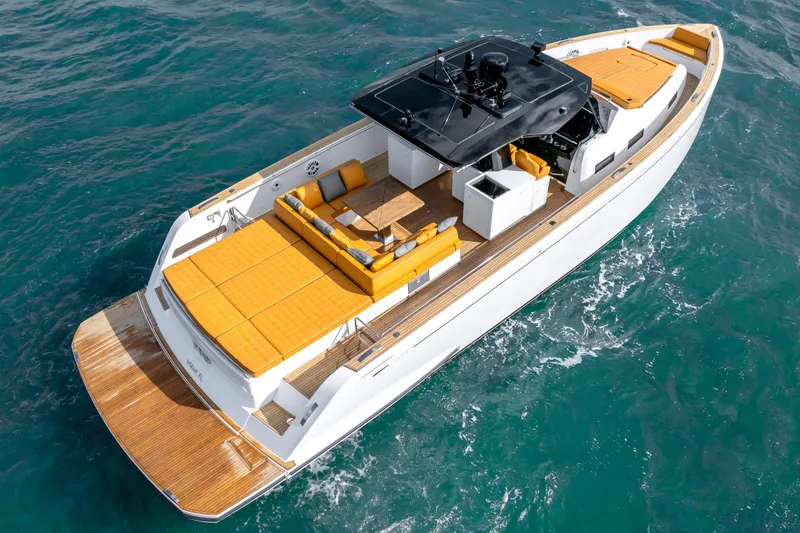 Slide: The Image of 2023 Pardo Yachts 50 luxury yacht cruising on open water, featuring sleek design and spacious deck. - 2