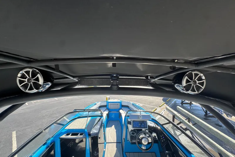 Slide: The Image of 2022 Yamaha Boats 255XD interior with speakers and control panel, showcasing modern design. - 13