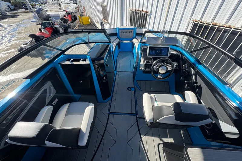 Slide: The Image of 2022 Yamaha Boats 255XD interior with modern dashboard and seating. - 15