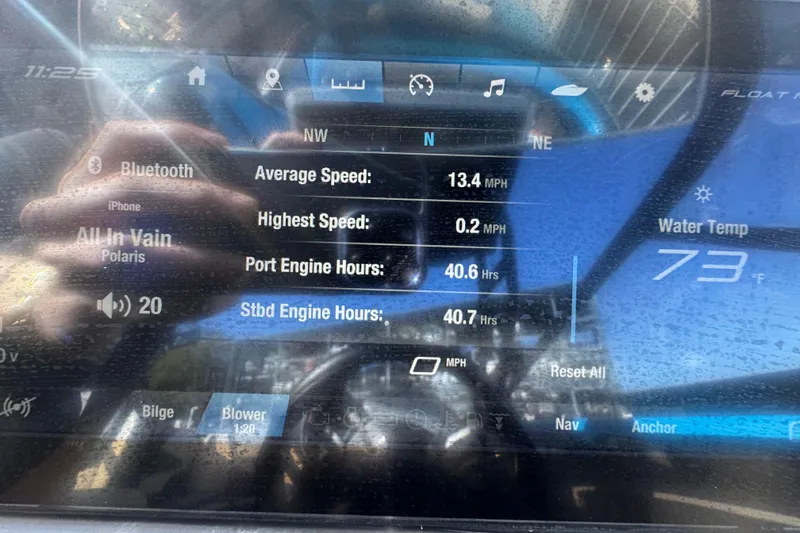 Slide: The Image of Dashboard of 2022 Yamaha Boats 255XD showing speed, engine hours, and water temperature. - 19