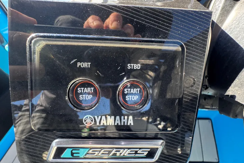 Slide: The Image of Control panel of 2022 Yamaha Boats 255XD with start/stop buttons and E-Series logo. - 20