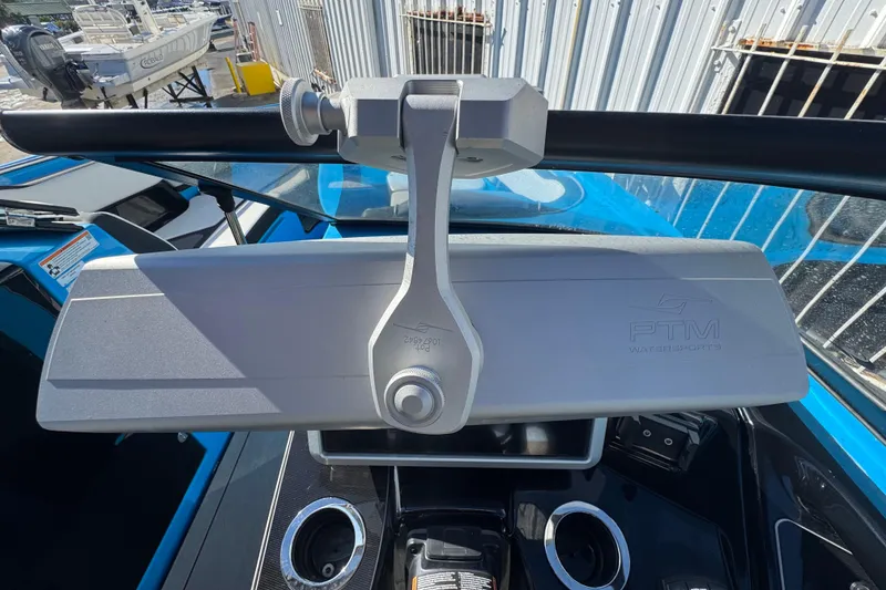 Slide: The Image of 2022 Yamaha Boats 255XD dashboard with PTM Watersports mirror and cup holders. - 21