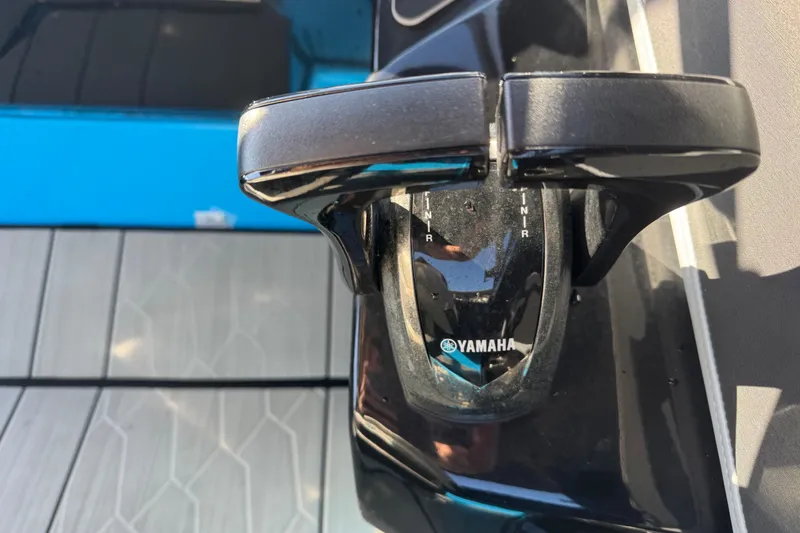 Slide: The Image of Close-up of Yamaha Boats 255XD 2022 throttle control on deck. - 23