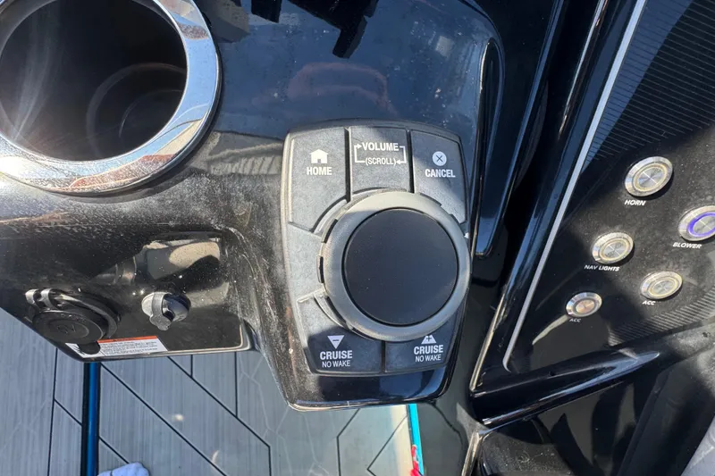 Slide: The Image of Control panel of 2022 Yamaha Boats 255XD with volume and cruise buttons. - 25