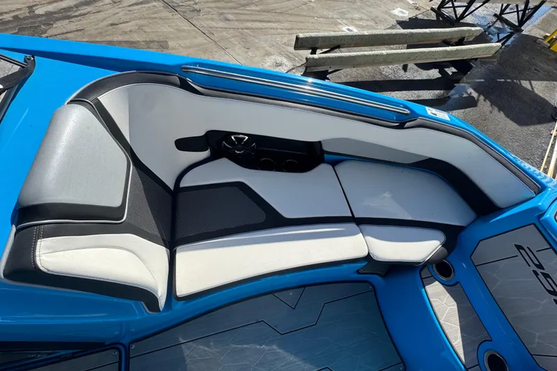 Slide: The Image of 2022 Yamaha Boats 255XD interior with blue and gray seating. - 37