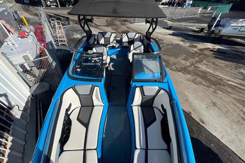 Slide: The Image of 2022 Yamaha Boats 255XD with sleek blue design and spacious seating. - 42