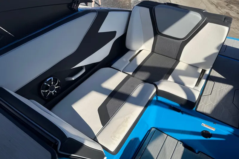 Slide: The Image of 2022 Yamaha Boats 255XD interior seating with modern design and speaker system. - 59