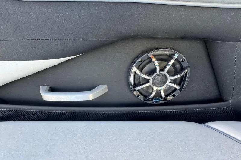 Slide: The Image of Interior of 2022 Yamaha Boats 255XD featuring speaker and handle detail. - 66