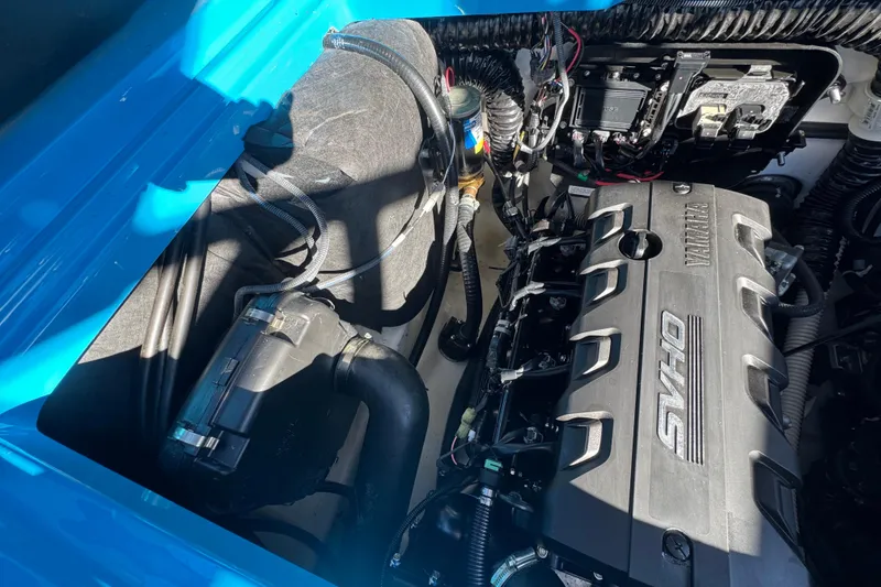 Slide: The Image of Engine compartment of 2022 Yamaha Boats 255XD, showcasing SVHO engine components and wiring. - 71
