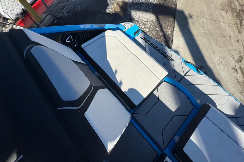 Slide: The Image of 2022 Yamaha Boats 255XD interior seating with sleek design and modern upholstery. - 74