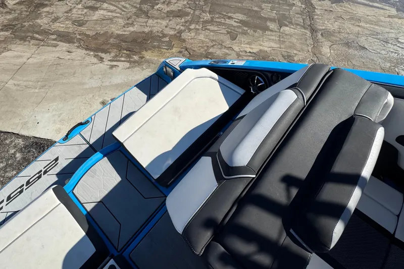 Slide: The Image of 2022 Yamaha Boats 255XD interior seating with sleek design and modern upholstery. - 79