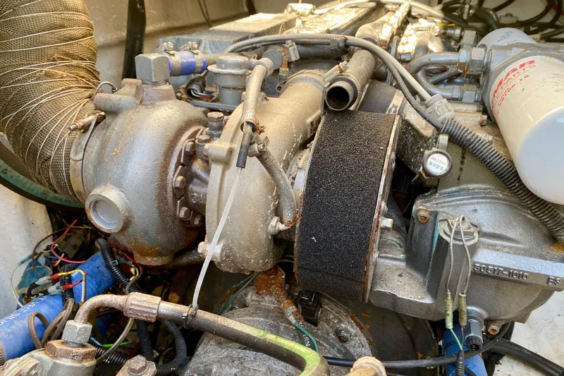 Slide: The Image of Close-up of a 2001 SportsCat 44 engine with visible components and wiring. - 104