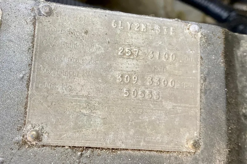 Slide: The Image of Close-up of a SportsCat 44 engine plate, displaying technical specifications. - 105