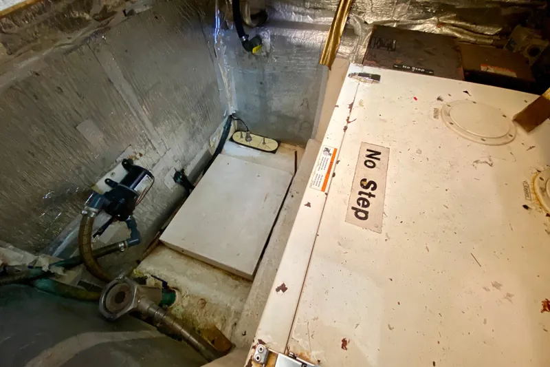 Slide: The Image of Engine compartment of a 2001 SportsCat 44 with "No Step" warning label. - 109