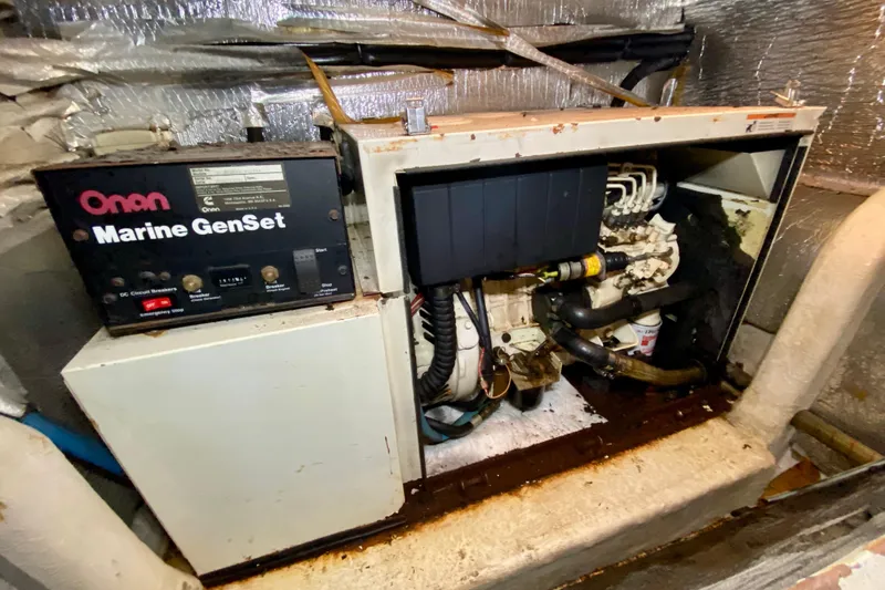 Slide: The Image of Onan Marine GenSet in 2001 SportsCat 44 engine room, showing generator components. - 110
