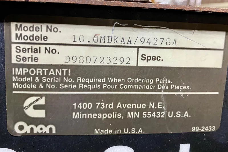 Slide: The Image of Label displaying model and serial numbers for Cummins Onan equipment, Minneapolis address. - 113