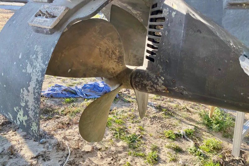 Slide: The Image of Propeller of a 2001 SportsCat 44 boat on dry land. - 19