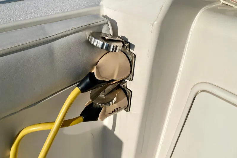 Slide: The Image of Yellow power cables connected to a SportsCat 44 boat, model year 2001. - 23