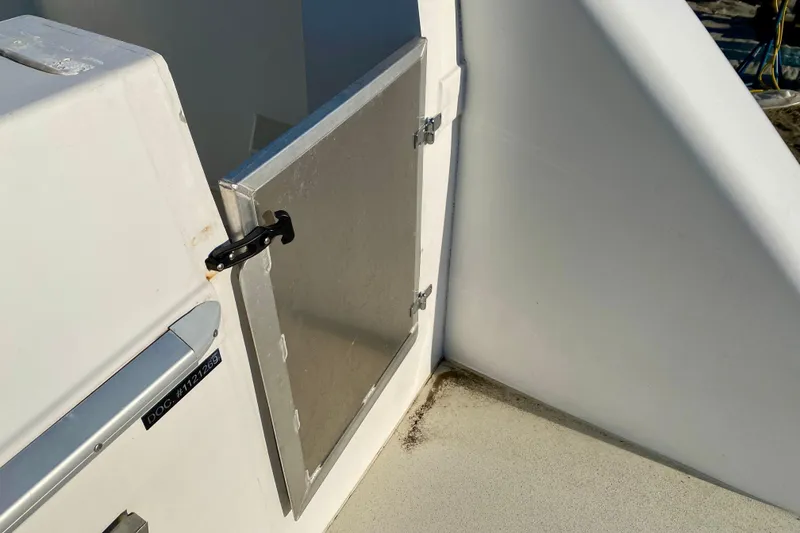 Slide: The Image of Aluminum door on 2001 SportsCat 44 boat, featuring a secure latch mechanism. - 25