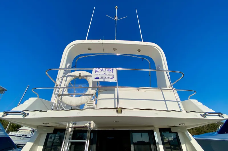 Slide: The Image of 2001 SportsCat 44 yacht with lifebuoy and Beaufort sign against clear blue sky. - 28