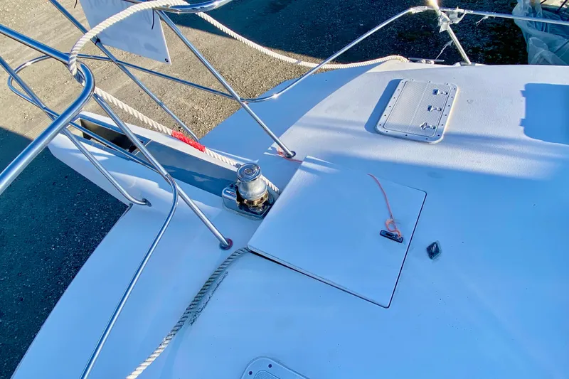 Slide: The Image of Deck of 2001 SportsCat 44 boat with winch and ropes. - 36