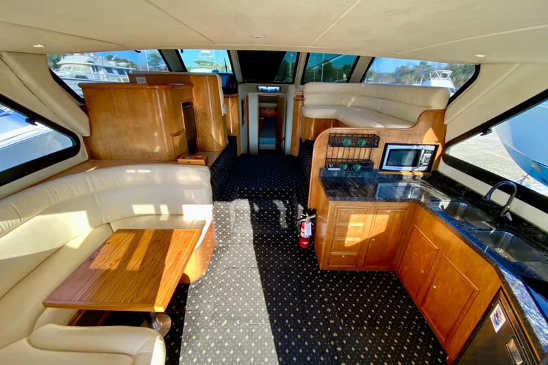 Slide: The Image of Luxurious interior of 2001 SportsCat 44 yacht with kitchen and seating area. - 50