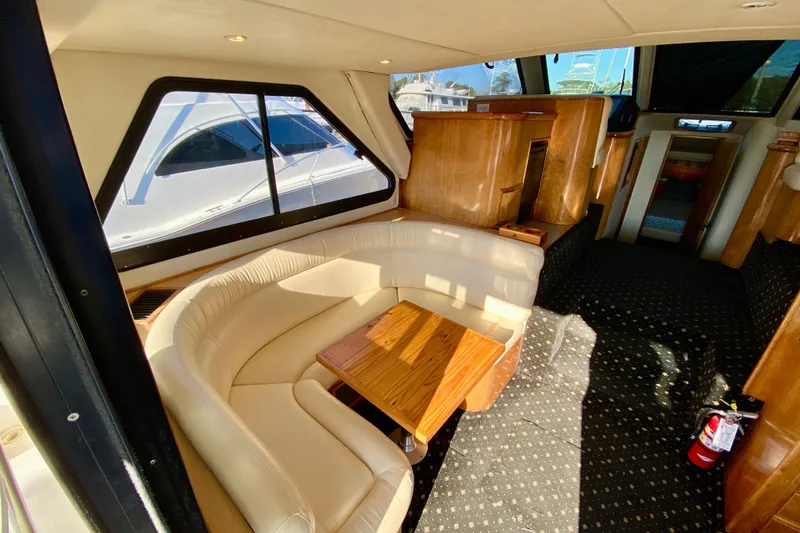 Slide: The Image of Luxurious 2001 SportsCat 44 yacht interior with leather seating and wooden accents. - 52
