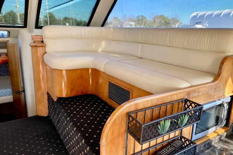 Slide: The Image of Luxurious interior of 2001 SportsCat 44 with cream leather seating and wooden accents. - 54