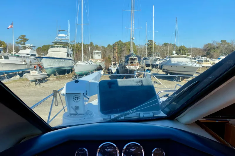 Slide: The Image of View from a SportsCat 44 boat, 2001 model, in a marina with various docked boats. - 59