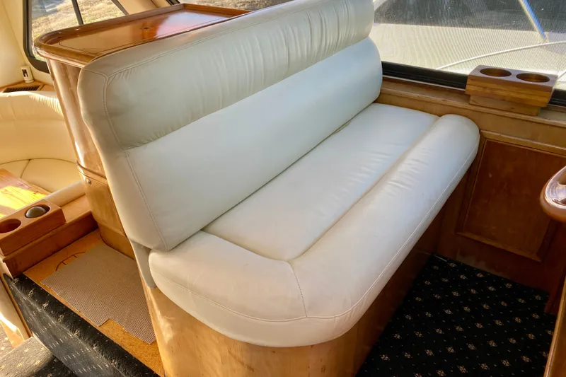 Slide: The Image of Luxurious interior of 2001 SportsCat 44 with white leather seating and wooden accents. - 61