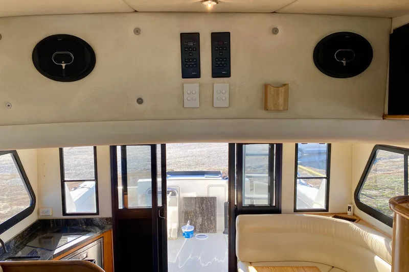 Slide: The Image of Interior of 2001 SportsCat 44 boat with modern controls and seating area. - 62