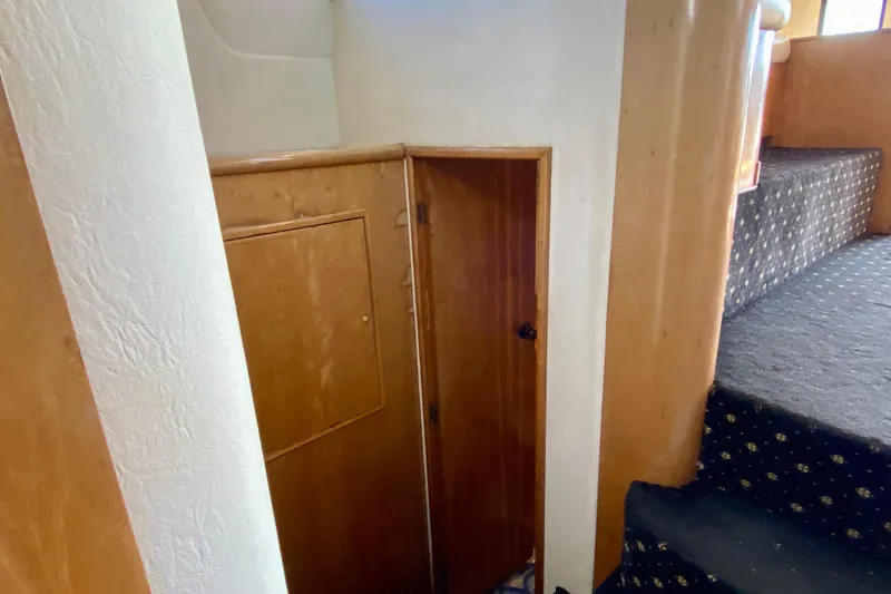 Slide: The Image of Interior of 2001 SportsCat 44, featuring wooden paneling and carpeted stairs. - 67