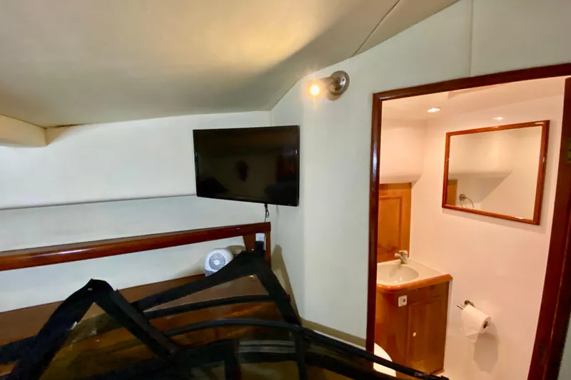 Slide: The Image of Interior of 2001 SportsCat 44 boat with TV and bathroom. - 79