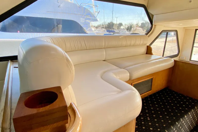 Slide: The Image of Luxurious interior of a 2001 SportsCat 44 yacht with plush white seating. - 84