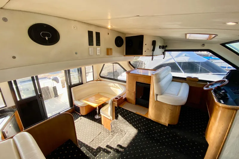 Slide: The Image of Luxurious 2001 SportsCat 44 yacht interior with plush seating and elegant wood finishes. - 85
