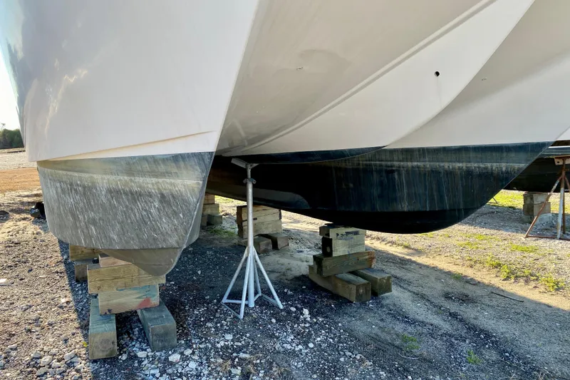 Slide: The Image of 2001 SportsCat 44 catamaran hull on blocks, dry docked for maintenance. - 9