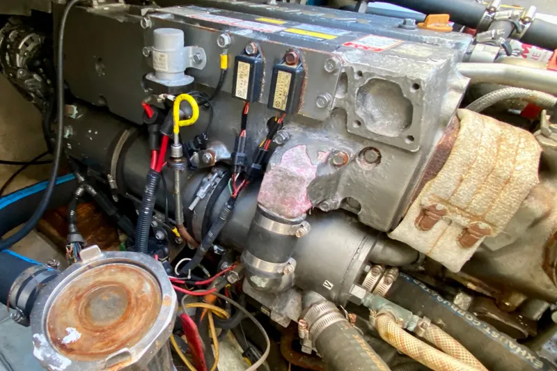 Slide: The Image of Engine compartment of a 2001 SportsCat 44, showcasing detailed mechanical components and wiring. - 95