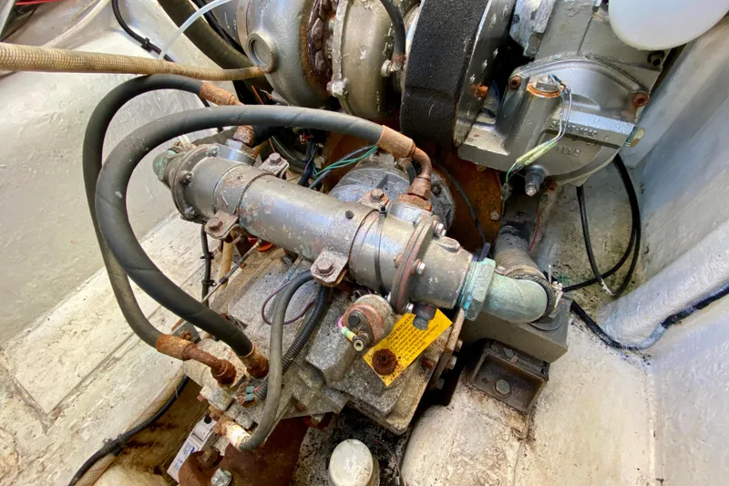 Slide: The Image of Engine compartment of a 2001 SportsCat 44, showcasing mechanical components and hoses. - 97