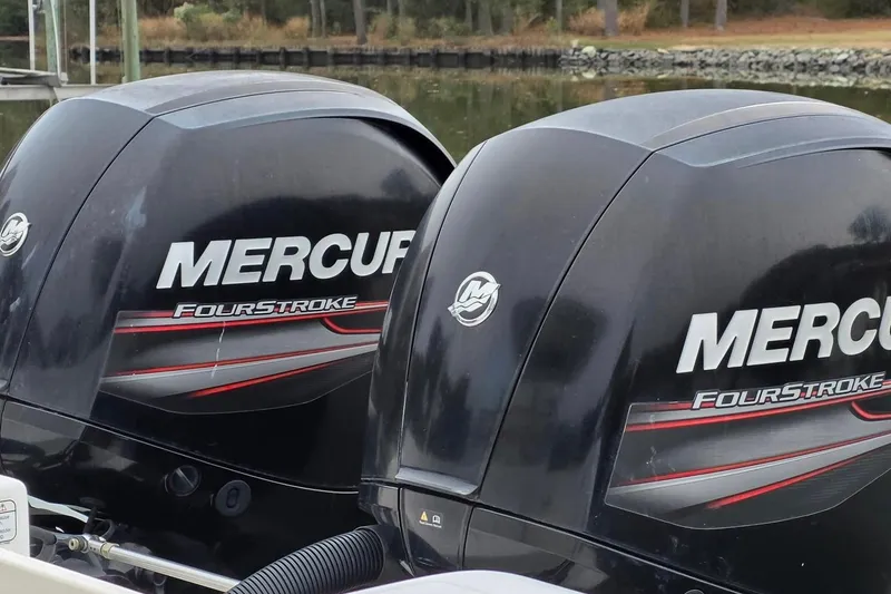 Slide: The Image of Twin Mercury FourStroke engines on a 2014 Mako 234 Center Console boat. - 3