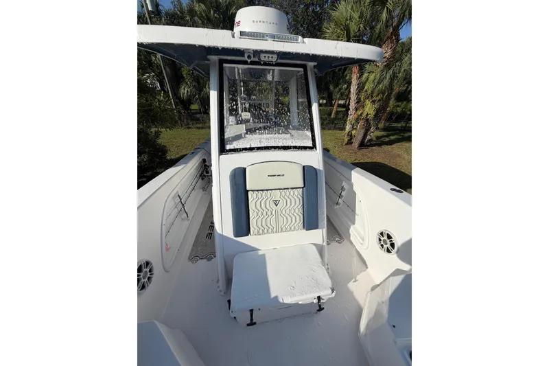 Slide: The Image of 2025 Twin Vee 260 GFX2 CC boat interior with modern console and seating. - 10