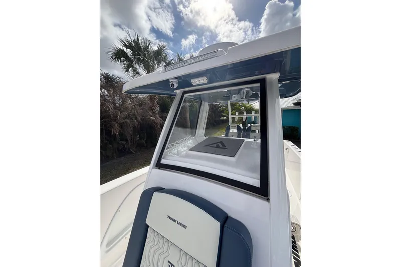 Slide: The Image of 2025 Twin Vee 260 GFX2 CC boat interior with modern design and seating. - 12