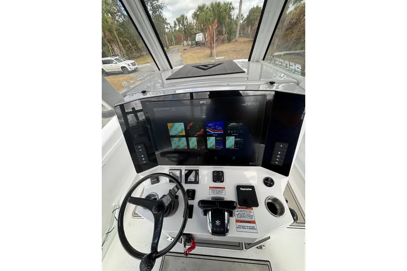 Slide: The Image of 2025 Twin Vee 260 GFX2 CC boat dashboard with advanced navigation display. - 20